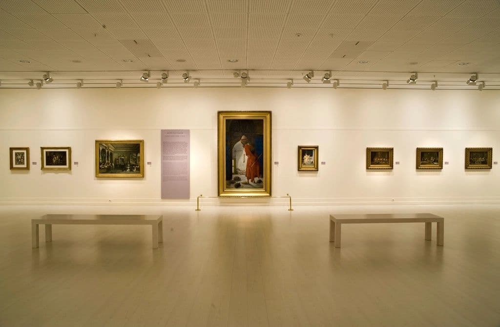 Gallery exhibition hall with framed works on display