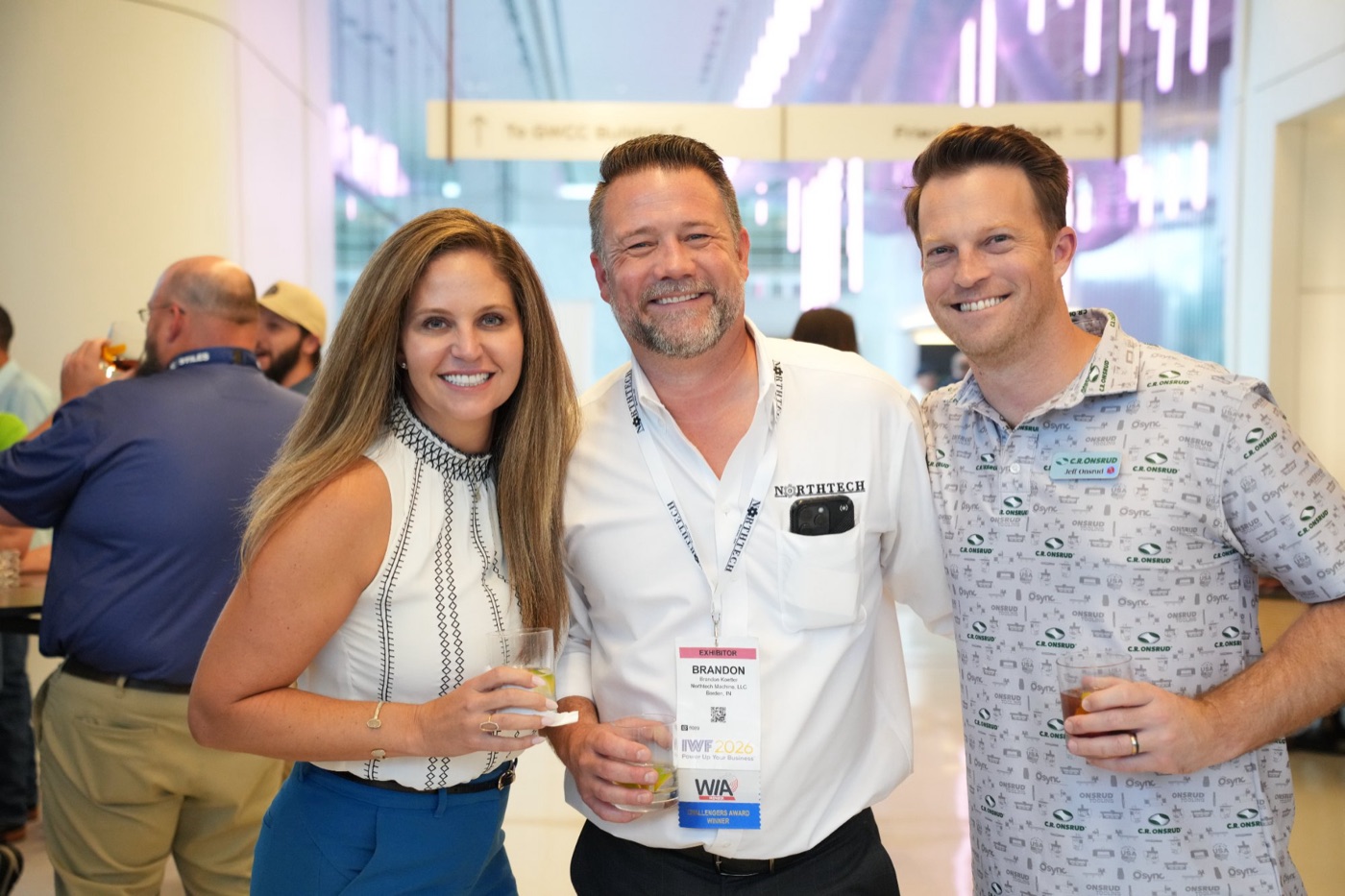 Three guests posing at the cocktail hour