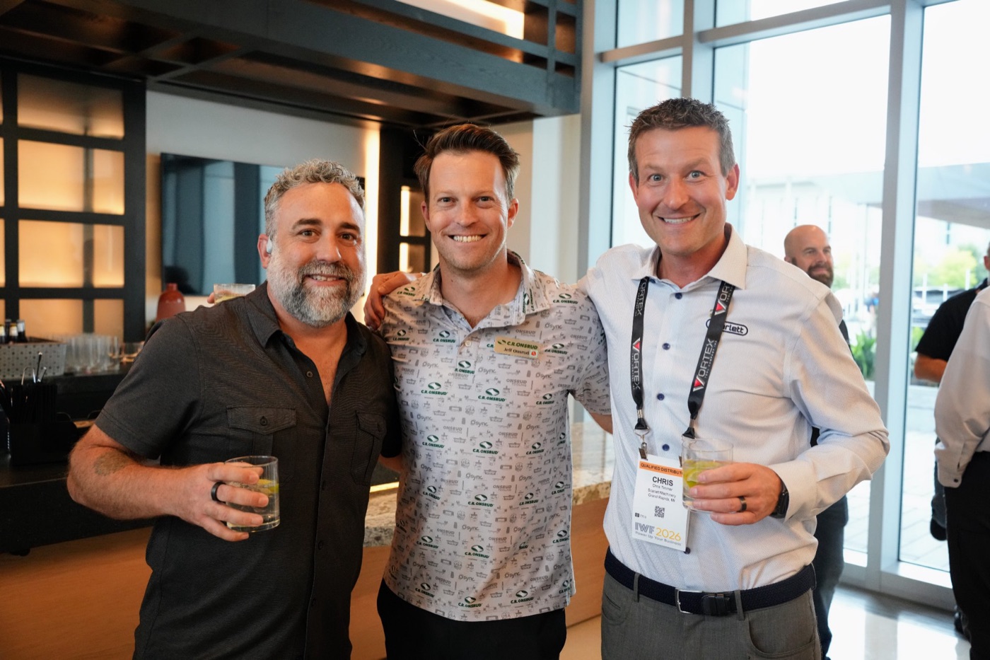 Three guests raising a glass at the cocktail hour