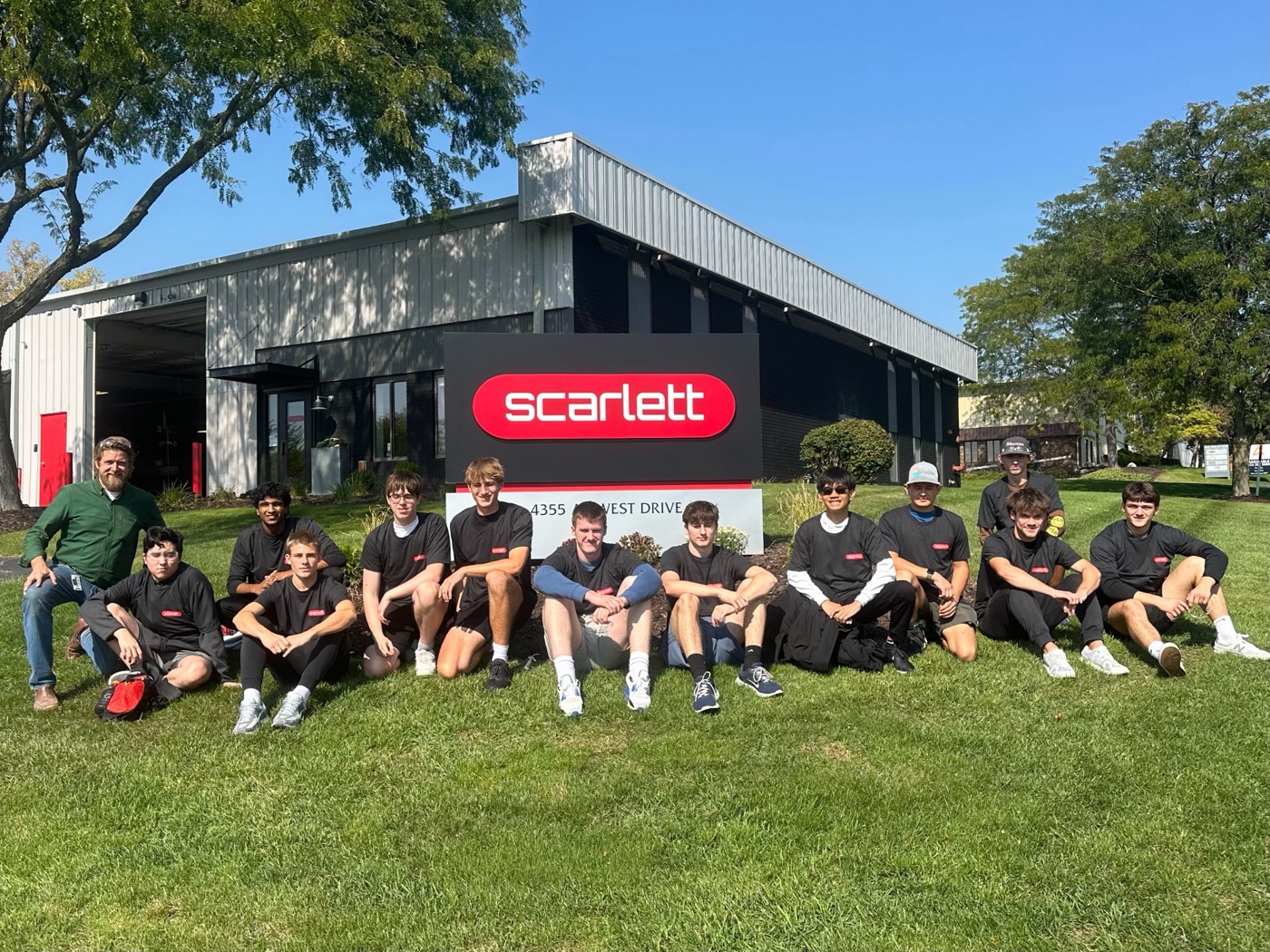 The Forest Hills Central advanced woodworking class in front of the Scarlett building