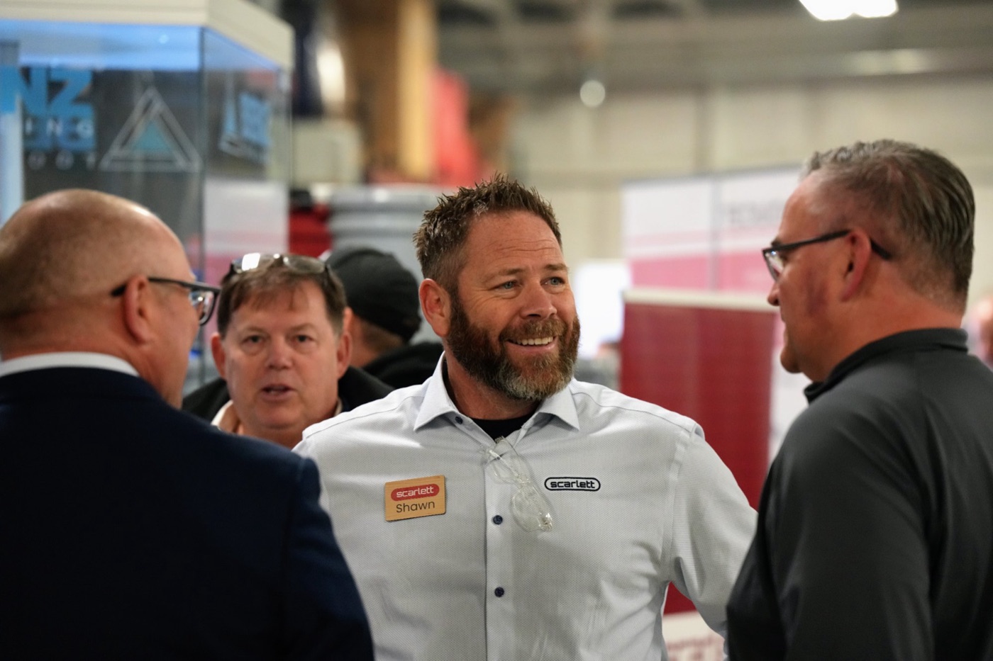Guests talking in the showroom during the 60th anniversary open house