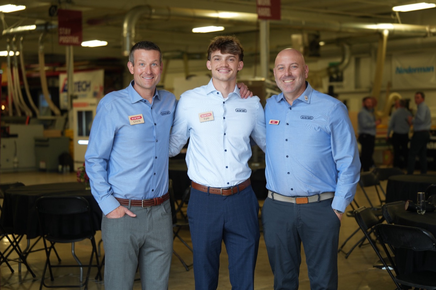 Three Scarlett team members in the showroom during the open house