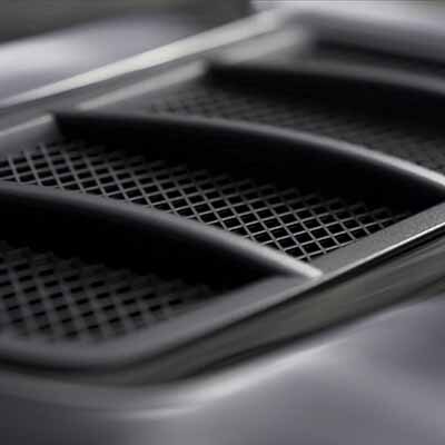 Air intake in the carbon hood of sport car. Luxury car exterior details.